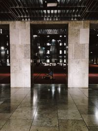 Man in illuminated room