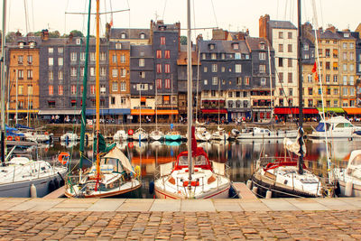 Boats moored at harbor