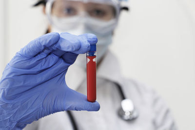 Close-up of doctor holding test tube