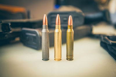 Close-up of illuminated candles on table