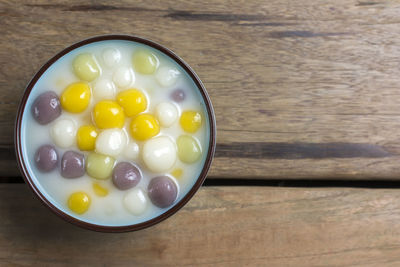 High angle view of candies in bowl on table