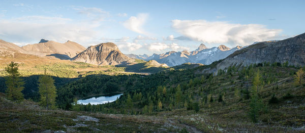 Beautiful alpine valley with forest, lake, mountains before sunset, panorama, mt assiniboine, canada