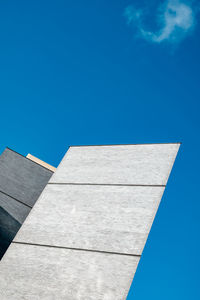 Low angle view of building against blue sky
