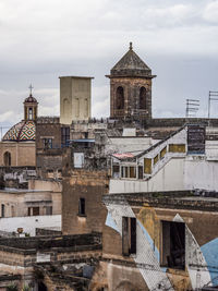 Buildings in city against sky