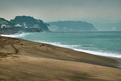 Scenic view of beach against sky