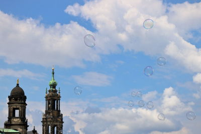 Low angle view of bubbles against sky