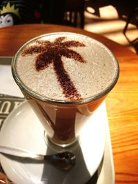 Close-up of cappuccino served on table