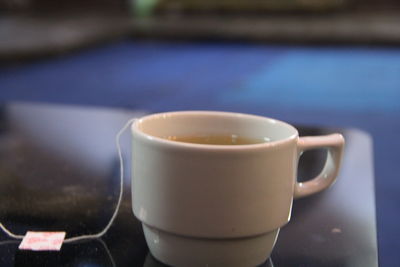 Close-up of coffee cup on table