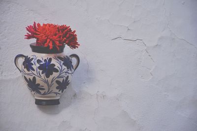 Flower vase mounted on wall