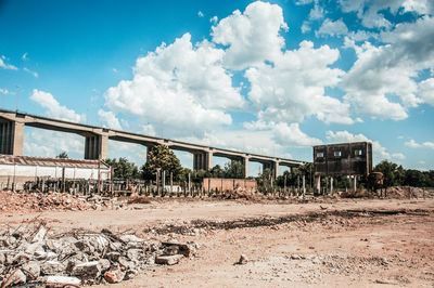 Panoramic view of abandoned train against sky