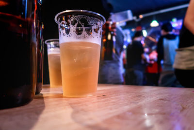 Close-up of beer glass on table