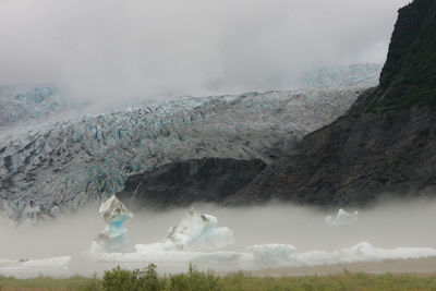 Scenic view of mountains against sky during winter