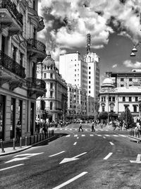 City street amidst buildings against sky