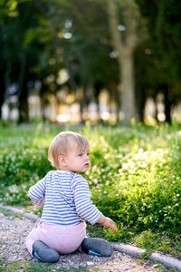 Cute girl sitting on grass