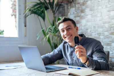 Young man using laptop on table