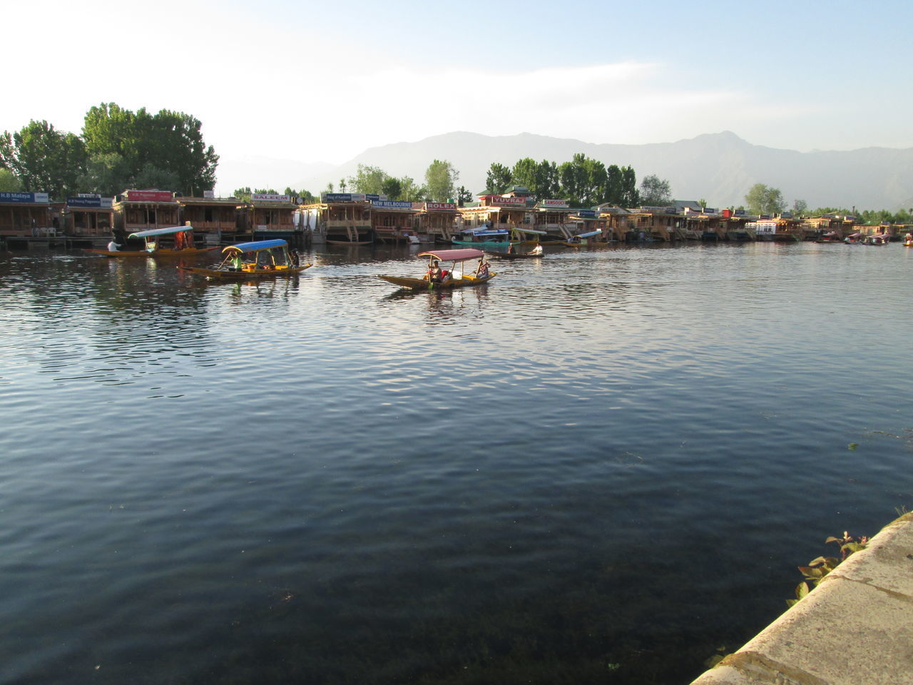 BOATS ON LAKE AGAINST SKY