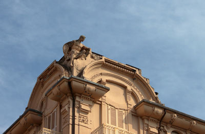 Decorative statue on the roof of a prestigious building