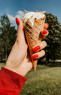 Cropped hand of person holding ice cream