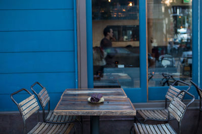 Chairs and table against window