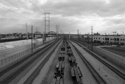 Railroad track against cloudy sky
