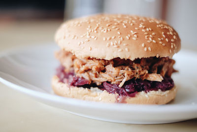 Close-up of burger in plate on table