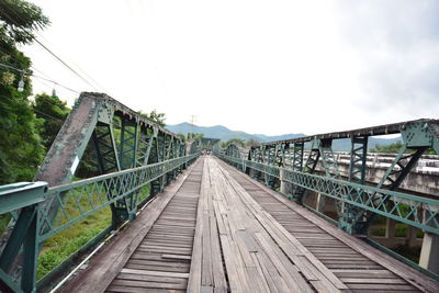 Footbridge against sky