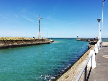 Scenic view of sea against clear blue sky