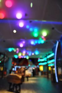 Defocused image of illuminated lights at restaurant