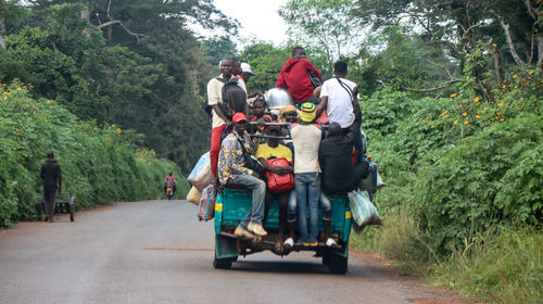 People riding motorcycle on road