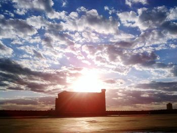 Sun shining through clouds