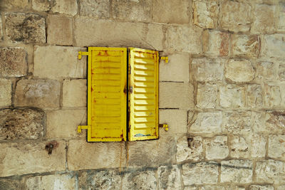 Close-up of yellow brick wall