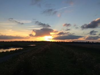 Scenic view of landscape at sunset