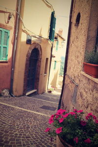 View of alley amidst buildings