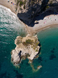 High angle view of rock formations on shore