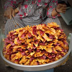 Midsection of vendor selling fast food in market