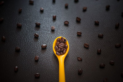 Full frame shot of roasted coffee beans on table