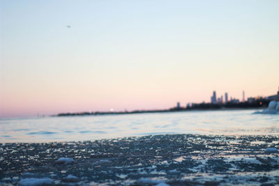 Scenic view of sea against clear sky during sunset