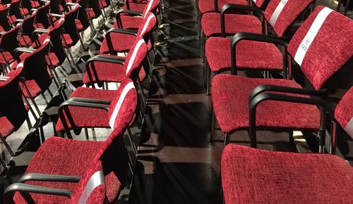 High angle view of empty chairs arranged theatre