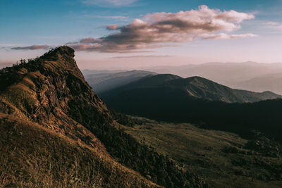 Scenic view of mountains against sky at sunset