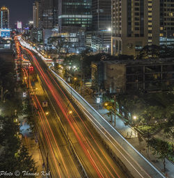 High angle view of light trails on city street at night