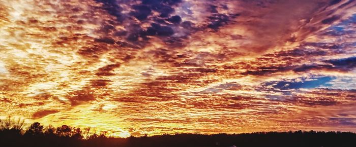 Low angle view of dramatic sky at sunset