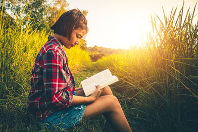 Women read book in quiet prairie green, concept read a book.