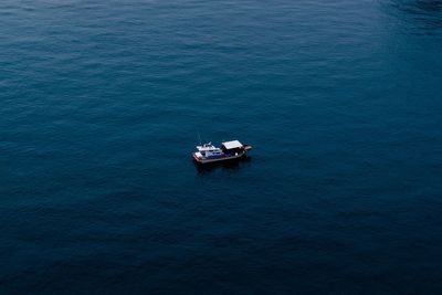 High angle view of ship sailing in sea