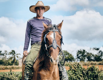 Portrait of horse on field