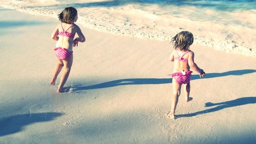 Girl playing at beach