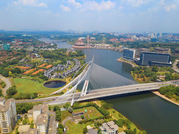 High angle view of bridge over river amidst buildings in city