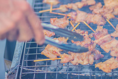 Close-up of meat on barbecue grill