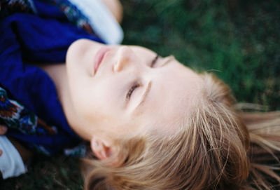 Close-up of young woman sleeping outdoors