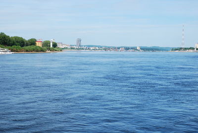 Scenic view of sea and buildings against sky