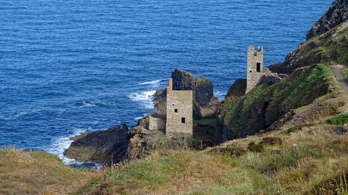 High angle view of historic building by sea